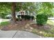 A mature tree adds character to the front yard of this home at 65 Orchard Dr, Covington, GA 30014