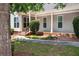 Manicured front lawn showcasing inviting entry way at 65 Orchard Dr, Covington, GA 30014