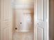 Laundry room with tile floors and wire shelving at 65 Orchard Dr, Covington, GA 30014