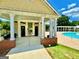 Community pool house with bathrooms, a covered entrance, and views of the swimming pool at 65 Orchard Dr, Covington, GA 30014