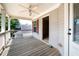 Relaxing covered porch with ceiling fan, providing a comfortable outdoor space at 65 Orchard Dr, Covington, GA 30014