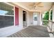 Relaxing covered porch with ceiling fan, providing a comfortable outdoor space at 65 Orchard Dr, Covington, GA 30014
