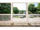 Charming porch offering a serene view of the neighborhood and surrounding greenery at 65 Orchard Dr, Covington, GA 30014