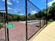 Community tennis court with fencing and an accessible entrance at 65 Orchard Dr, Covington, GA 30014