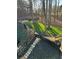 Stone steps lead to a manicured backyard with a firepit and a natural wooded setting at 126 Laguna Springs Dr, Woodstock, GA 30188