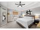 Bright main bedroom with tray ceiling, fan, and natural light at 126 Laguna Springs Dr, Woodstock, GA 30188