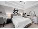 Cozy primary bedroom featuring tray ceilings, ceiling fan and neutral tones at 126 Laguna Springs Dr, Woodstock, GA 30188