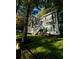 Charming home with a painted brick facade, complemented by a lush green lawn at 126 Laguna Springs Dr, Woodstock, GA 30188