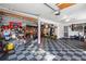 Large two-car garage with checkerboard floors and plenty of room for storage along the back wall of the garage at 126 Laguna Springs Dr, Woodstock, GA 30188