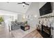 Inviting living room featuring a cozy fireplace, vaulted ceiling and comfortable seating at 126 Laguna Springs Dr, Woodstock, GA 30188