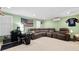 Living room with green walls, comfortable seating, desk and TV at 126 Laguna Springs Dr, Woodstock, GA 30188