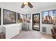 Bright sunroom with views of the property and tile flooring at 126 Laguna Springs Dr, Woodstock, GA 30188
