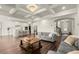Spacious living room featuring hardwood floors, recessed lighting, large archways, and views to the entryway at 1590 Branthaven Ln, Auburn, GA 30011