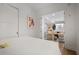 Bright bedroom boasts light walls, sliding door, and view to living area with modern finishes at 1820 Peachtree Nw St # 303, Atlanta, GA 30309