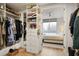 Organized walk-in closet leads to bedroom, with ample storage at 1820 Peachtree Nw St # 303, Atlanta, GA 30309