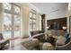 Clubhouse living area looks out to pool and features cozy sofa, oversized chairs, and large windows at 1820 Peachtree Nw St # 303, Atlanta, GA 30309