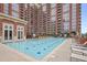 Enjoy the luxurious outdoor pool with plenty of lounge seating in this community at 1820 Peachtree Nw St # 303, Atlanta, GA 30309
