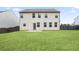 Level backyard has green lawn, privacy fence and back of house view at 203 Creek View Ln, Acworth, GA 30102