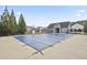 Closed community pool with tall trees and community building in the background at 203 Creek View Ln, Acworth, GA 30102