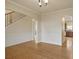 Open dining space with hardwood floors, wainscoting, and a staircase at 203 Creek View Ln, Acworth, GA 30102