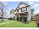 Well-maintained home with lush green lawn and trimmed shrubs, offering a welcoming curb appeal at 203 Creek View Ln, Acworth, GA 30102