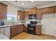 Updated kitchen featuring stainless appliances, granite countertops and wooden cabinetry at 203 Creek View Ln, Acworth, GA 30102
