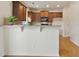 Kitchen area featuring white wainscoting, granite countertops, and modern hardwood flooring at 203 Creek View Ln, Acworth, GA 30102