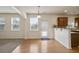 View of the kitchen, breakfast bar and living room with windows at 203 Creek View Ln, Acworth, GA 30102