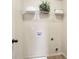 Laundry room with white shelving, with supplies, and tile flooring at 203 Creek View Ln, Acworth, GA 30102