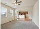 Open concept living room with carpet and views into kitchen at 203 Creek View Ln, Acworth, GA 30102