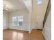 Bright and open living room with a vaulted ceiling, staircase, and hardwood floors at 203 Creek View Ln, Acworth, GA 30102