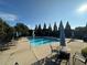 Community pool featuring lounge chairs, umbrellas, and shaded seating for a relaxing afternoon at 203 Creek View Ln, Acworth, GA 30102