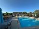 Community pool with lounge chairs and a clubhouse at 203 Creek View Ln, Acworth, GA 30102