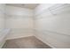Walk-in closet with carpet flooring and white wire shelving on all sides at 203 Creek View Ln, Acworth, GA 30102