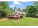 Wide shot of a backyard with a deck and grass at 4773 Aberdeen Ln, Stone Mountain, GA 30083