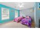 Bright and cheery bedroom with twin beds, colorful decor, and ample natural light at 4773 Aberdeen Ln, Stone Mountain, GA 30083