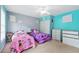 A bedroom with two beds, white closet doors and bright paint at 4773 Aberdeen Ln, Stone Mountain, GA 30083