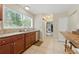 Updated kitchen showcasing granite countertops, tile backsplash, and a sunlit window at 4773 Aberdeen Ln, Stone Mountain, GA 30083