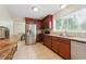 Well-lit kitchen featuring stainless steel appliances, granite countertops, and custom wood cabinetry at 4773 Aberdeen Ln, Stone Mountain, GA 30083