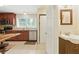 Spacious kitchen area adjacent to a convenient half-bathroom with updated fixtures and finishes at 4773 Aberdeen Ln, Stone Mountain, GA 30083