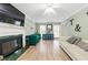 Spacious living room with fireplace, stylish decor, and abundant natural light at 4773 Aberdeen Ln, Stone Mountain, GA 30083