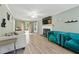 Cozy living room featuring hardwood floors, a fireplace, and access to a deck at 4773 Aberdeen Ln, Stone Mountain, GA 30083