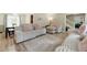 Inviting living room with stylish sofas, a large window, and view into the entry hall at 4773 Aberdeen Ln, Stone Mountain, GA 30083