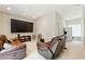 Cozy living room featuring leather recliner sofas and a large screen television for relaxed entertainment at 4773 Aberdeen Ln, Stone Mountain, GA 30083