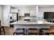 Stylish kitchen with white cabinets, stainless steel appliances, granite countertops, and a kitchen island at 11684 Stovall Pl, Hampton, GA 30228