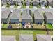Aerial view of backyard patios, solar panels, and lawn at 11684 Stovall Place Pl, Hampton, GA 30228