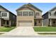 Charming two-story brick home with a well-manicured lawn and two-car garage, perfect for suburban living at 11684 Stovall Place Pl, Hampton, GA 30228