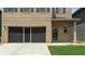 Garage door with screen in front of 2 car garage at 11684 Stovall Place Pl, Hampton, GA 30228