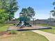 Community playground with swings, slide, and climbing area at 11684 Stovall Place Pl, Hampton, GA 30228