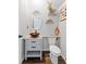 Chic powder room featuring a vessel sink, granite countertop, and decorative accents, great for guests at 11684 Stovall Place Pl, Hampton, GA 30228